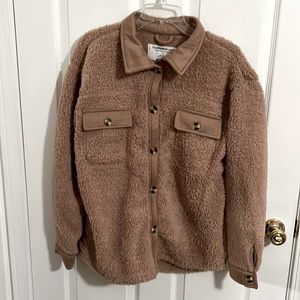 Never been worn fuzzy sweatshirt jacket. Warm and cozy!